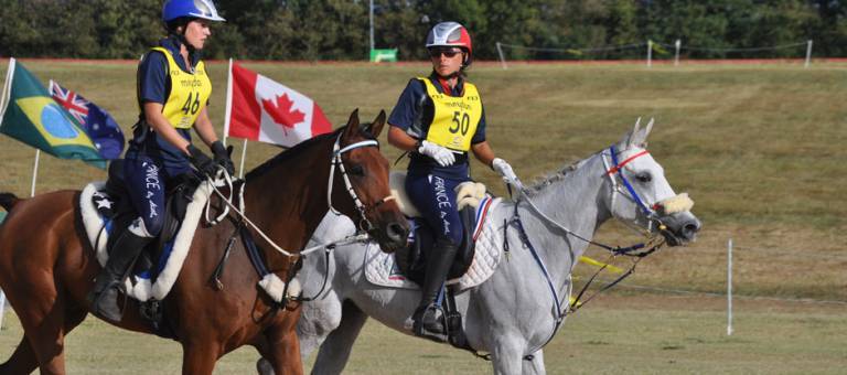 Two endurance riders on course during competition.