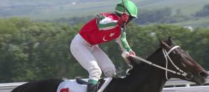 Jockey riding racehorse