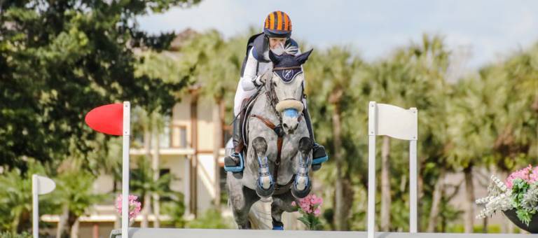 Head-on photo of Liz Halliday-Sharp and Cooley Moonshine jumping during cross-country at the Wellington Eventing Showcase.